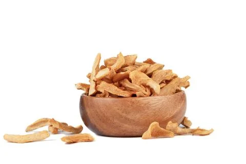 Dried apples or apple chips in a wooden bowl and on a white background. Stock Photos