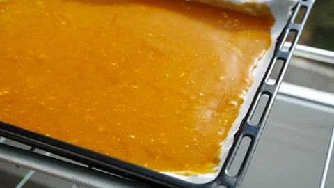 Dried apricot pulp in a tray, making pulp on oiled paper, apricot pulp, Vídeo Stock 227548537