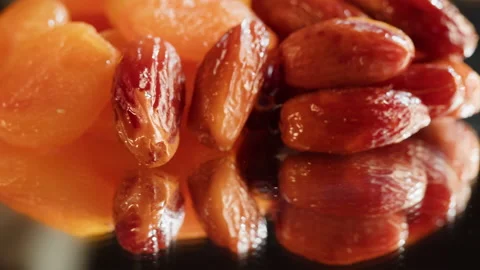 Dried apricots and dates close-up, dry fruits, vegetarian food. Healthy eating Stock Footage 198734588