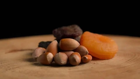 Dried apricots and hazelnuts Stock Footage 283772153