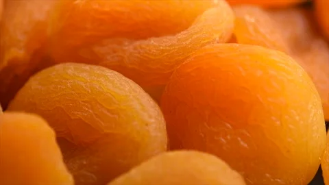Dried apricots background close-up. Apricot fruits. Ripe Organic Apricots fruit  Stockbeeldmateriaal 334043294