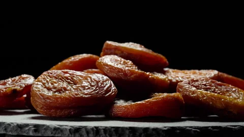 Dried apricots close up on black background. Vídeos de archivo 154451668