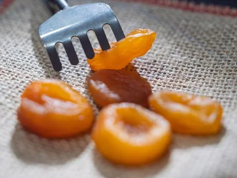 Dried Apricots on a Rustic Table with Fork Stock Photos