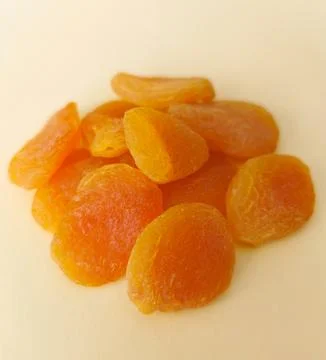 Dried apricots on a yellow background Stock Photos