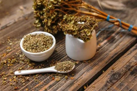 Dried basil spice in a small ceramic bowl Stock Photos