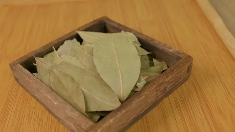 Dried bay leaves. Essential aromatic spice for cooking all kinds of tasty food. Stockbeeldmateriaal 340325989