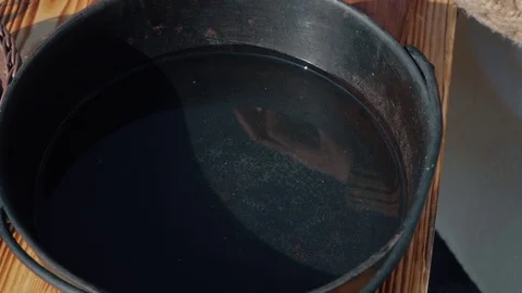 Dried beef meat cut into small pieces tossed into a pan close-up SLOW MOTION Stock Footage 129556562