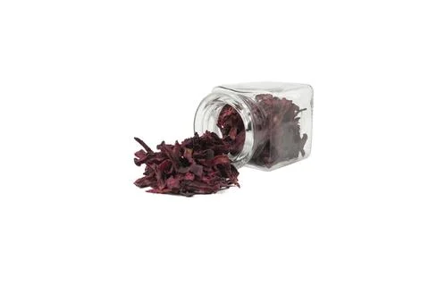 Dried beetroot slices falling out of the glass jar. food ingredient. Stock Photos