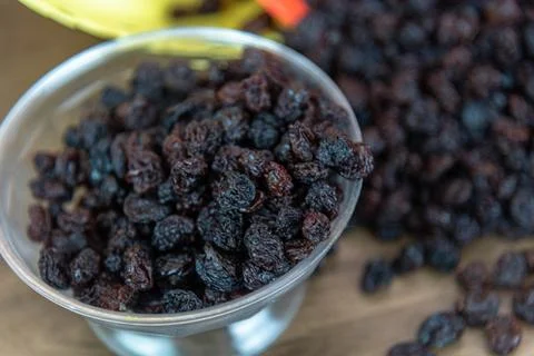 Dried black raisins Stock Photos