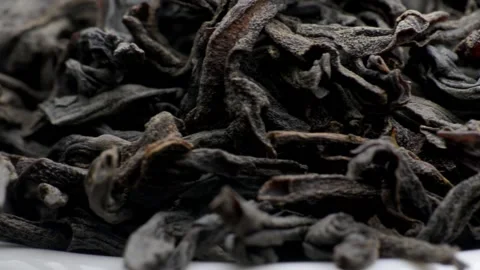Dried black tea leaves close up. macro photography. Slow motion close-up. Stock Footage 228121422