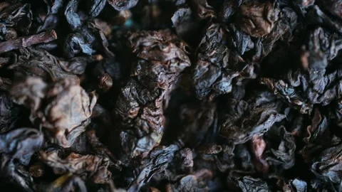 Dried black tea leaves rotating macro view Stock Footage 337830714