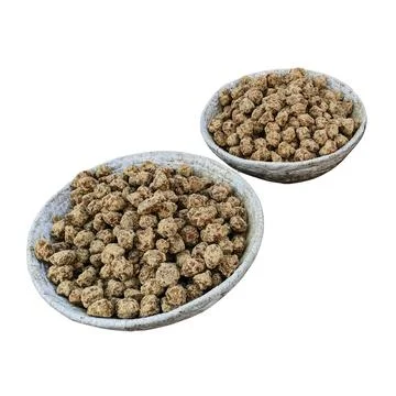 Dried Brown Soya Chunks in Stone Bowls Stockfoto's