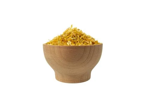 Dried Calendula or Marigold petals in wooden bowl isolated on white Stock Photos