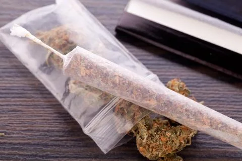 Dried Cannabis on Rolling Paper with Filter Stock Photos