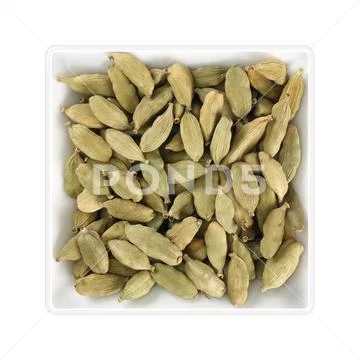 Dried cardamom in square bowl on white background Stock Photos