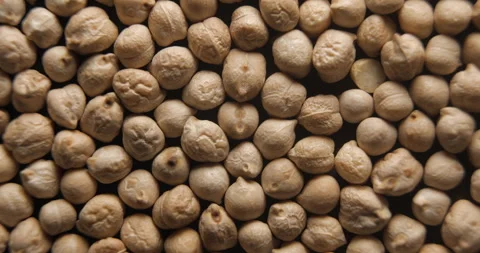 Dried chickpeas close up studio shot over rotating Video stock 334256267