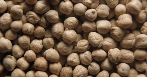 Dried chickpeas close up studio shot over rotating Video stock 334256381