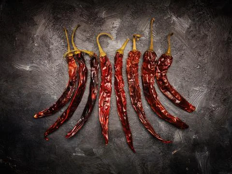 Dried chilis on a dark background Stock Photos