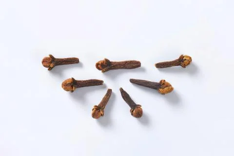 Dried cloves arranged in a pattern Stock Photos