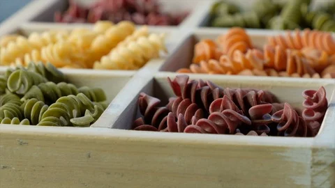 Dried colored fusilli pasta Stock Footage 92603758