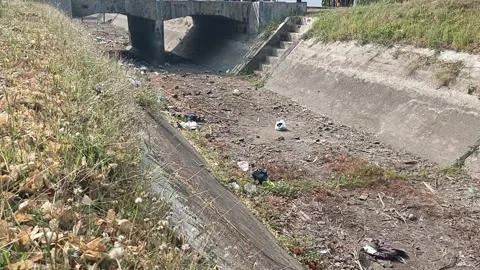 Dried Concrete Irrigation Canal with Plastic Garbage Litter Silent Видео 346016721
