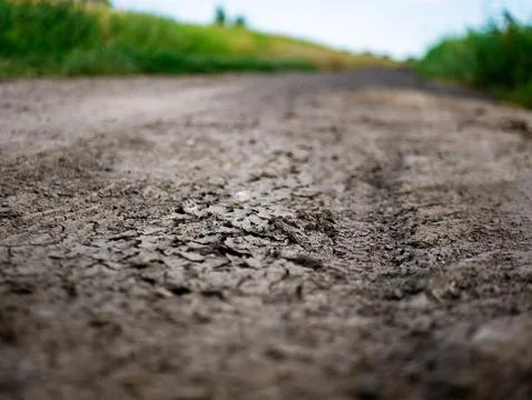 Dried cracked earth between crop fields in western Poland Stockfoto's