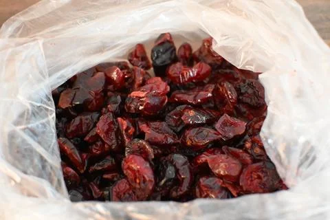 Dried Cranberries in Plastic Bag Close-Up, Healthy Snack Concept 스톡 사진