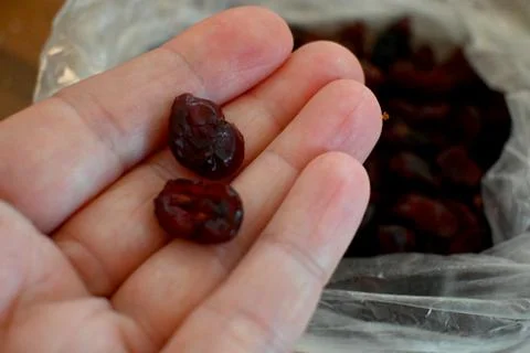 Dried Cranberries in Plastic Bag Close-Up, Healthy Snack Concept Stock Photos