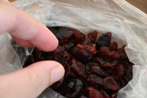Dried Cranberries in Plastic Bag Close-Up, Healthy Snack Concept 写真素材