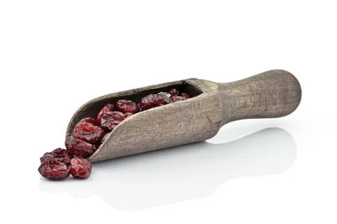 Dried cranberries in spoon Stock Photos