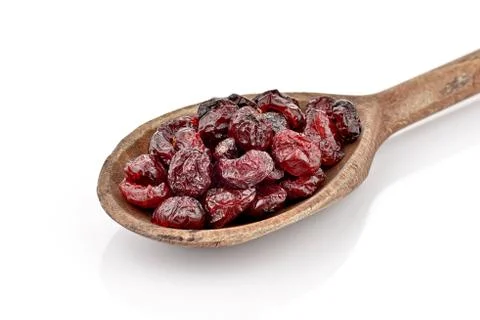 Dried cranberries in spoon Stock Photos