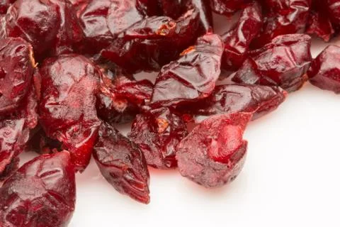 Dried cranberries on a white background. Stock Photos