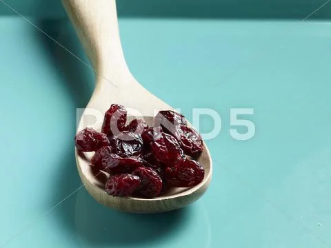 Dried Cranberries On A Wooden Spoon