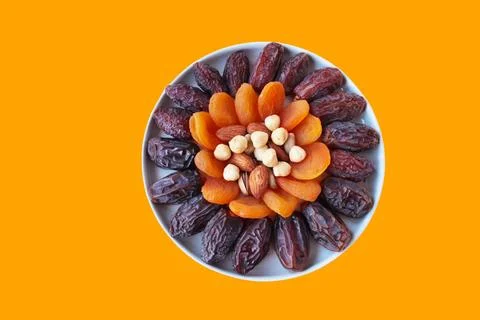 Dried date fruit designed on white plate Stock Photos