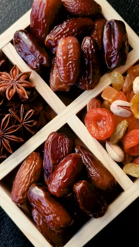 Dried dates on a ceramic plate for Ramadan or Iftar. Dates fruit as a background Stock Footage 331163206