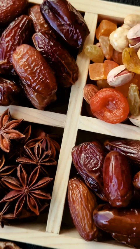 Dried dates on a ceramic plate for Ramadan or Iftar. Dates fruit as a background Stock Footage 331163210