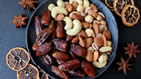 Dried dates on a ceramic plate for Ramadan or Iftar. Dates fruit as a background Stock Footage 331163222