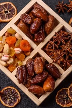 Dried dates on a ceramic plate for Ramadan or Iftar. Dates fruit as a backg.. Stock Photos