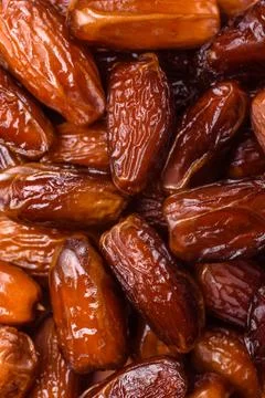 Dried dates on a ceramic plate for Ramadan or Iftar. Dates fruit as a backg.. Stock Photos