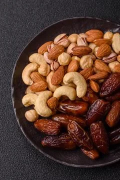Dried dates on a ceramic plate for Ramadan or Iftar. Dates fruit as a backg.. Stock Photos
