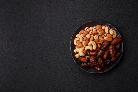 Dried dates on a ceramic plate for Ramadan or Iftar. Dates fruit as a backg.. Stock Photos