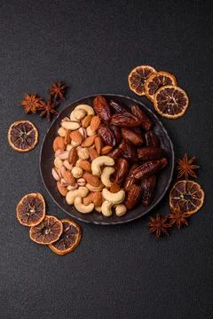Dried dates on a ceramic plate for Ramadan or Iftar. Dates fruit as a backg.. Stock Photos