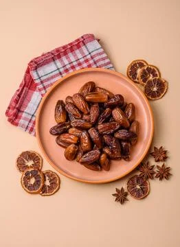 Dried dates on a ceramic plate for Ramadan or Iftar. Dates fruit as a backg.. Stock Photos