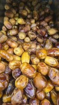 Dried dates close-up, showcasing the natural sweet texture of dried fruit. Stock Photos