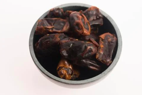 Dried dates fruit in a bowl Stock Photos