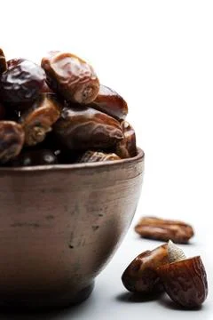 Dried dates fruit for iftar on Ramadan in the bowl Stock Photos
