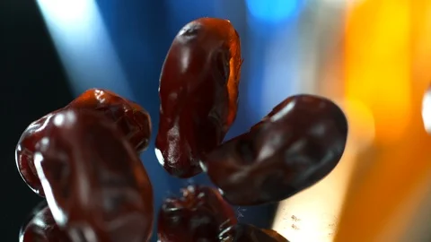 Dried dates fruits fall on the table , SLOW MOTION, 4k,PHANTOM Stock Footage 114980616