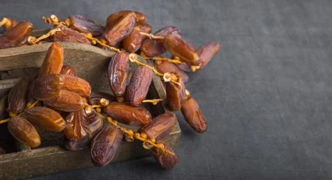 Dried dates on a grey background Foto stock