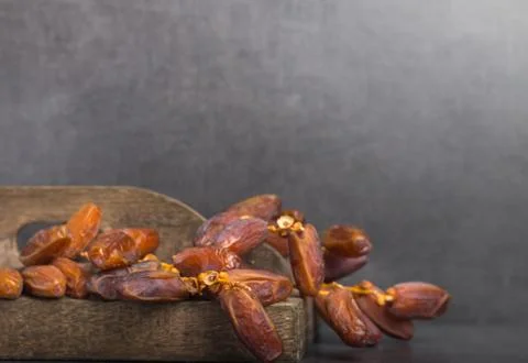 Dried dates on a grey background Stock Photos