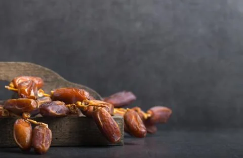 Dried dates on a grey background Foto stock